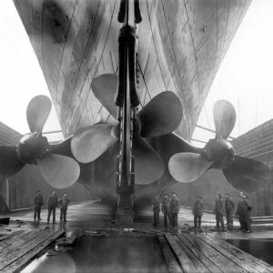 Vintage maritime history photo of the RMS Titanics propellers as the mighty ship sits in dry dock.