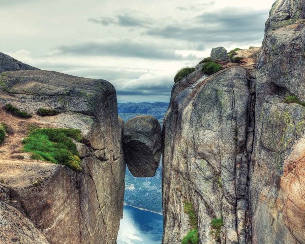 Kjerag Kjeragbolten rock in Kjerag Mountains, Norway