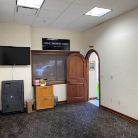 installing ceiling tiles in conference room