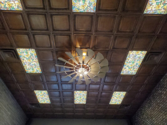 installing ceiling tiles in retail store