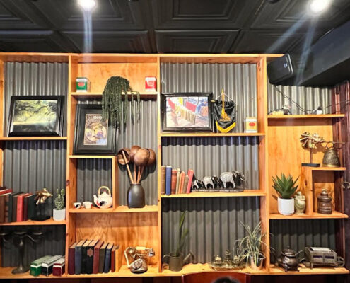 installing black minimalist ceiling tiles in restaurant