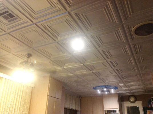 installing white ceiling tiles throughout home
