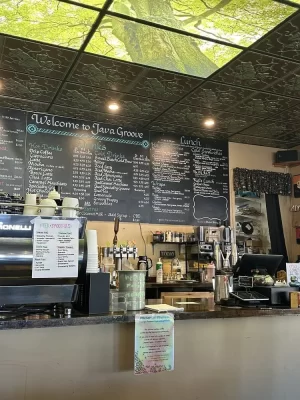 installing new ceiling tiles in cafe