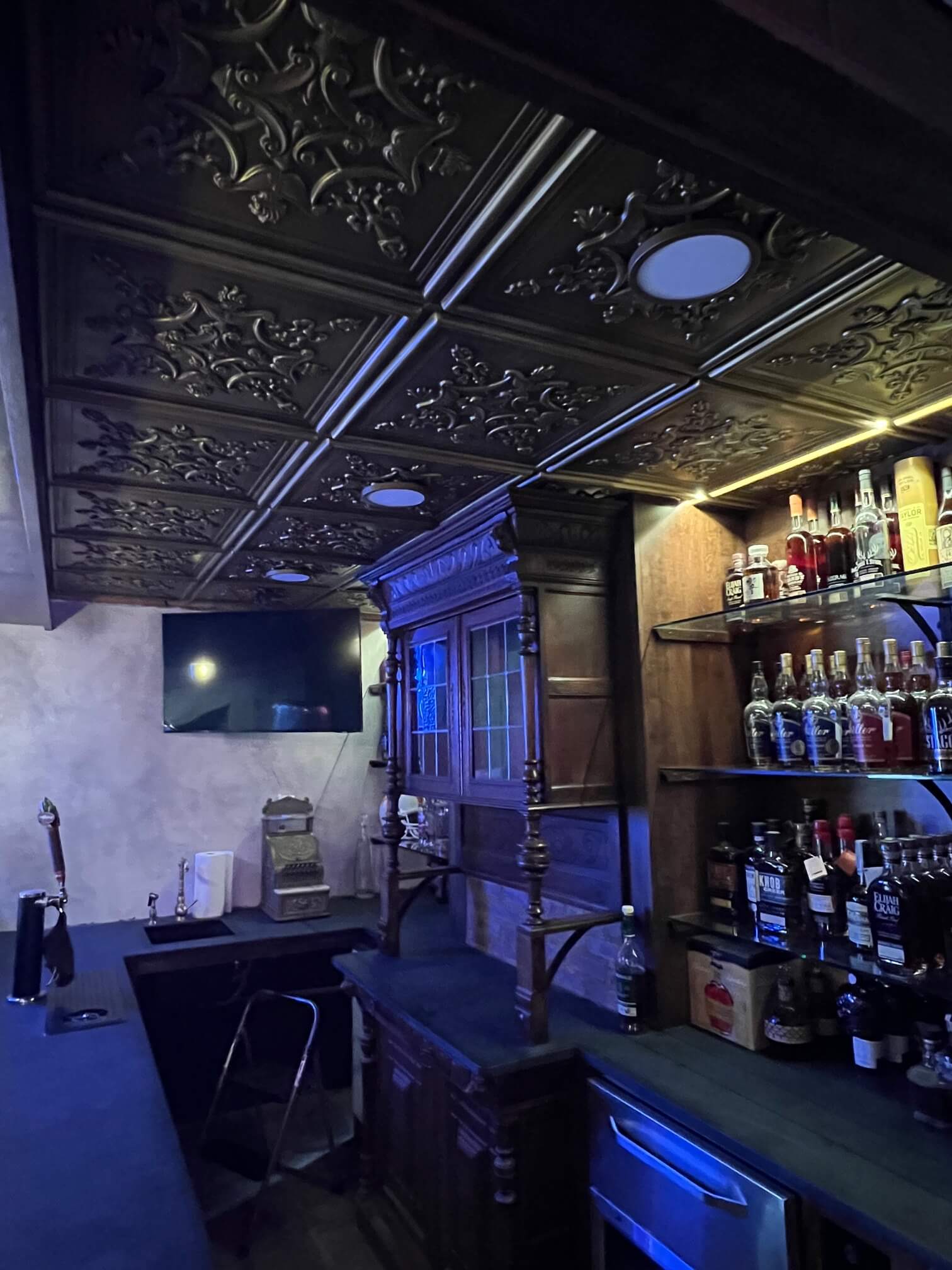 ceiling tiles installed in basement bar