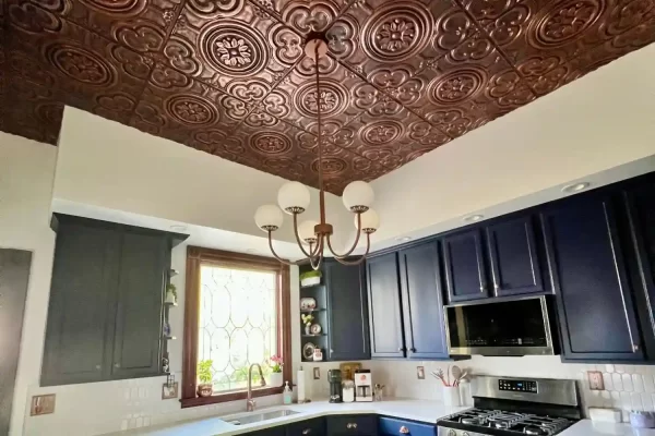 Eye-catching kitchen ceiling design using lightweight and easy to install rustic copper faux tin ceiling panels.