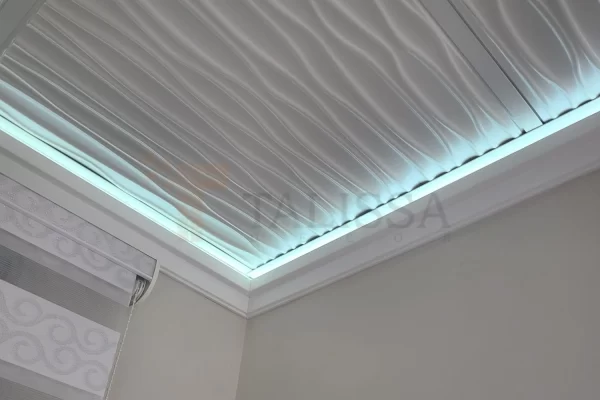 Corner view of a contemporary drop ceiling showcasing the seamless integration of LED crown molding using the lightweight 04-915 High Density Polymer profile.