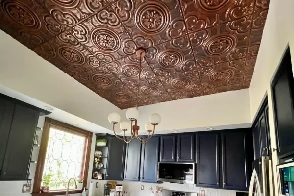 Beautiful kitchen remodel in Columbus, OH featuring dark blue cabinets perfectly contrasted by TD50 rustic copper ceiling tiles.