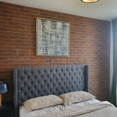 Talissa Decor Faux Bricks Wall Panels 112 installed as a brown textured accent wall behind a grey headboard in a Toronto bedroom.