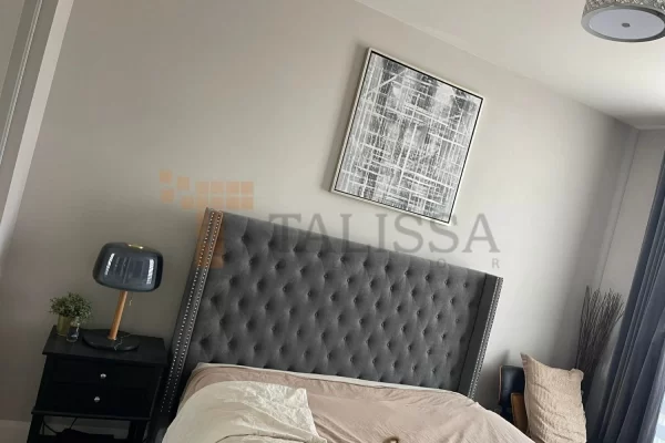 Before picture of a plain grey bedroom wall in a Toronto home, preparing for a DIY Faux Bricks Wall Panels 112 accent wall installation.