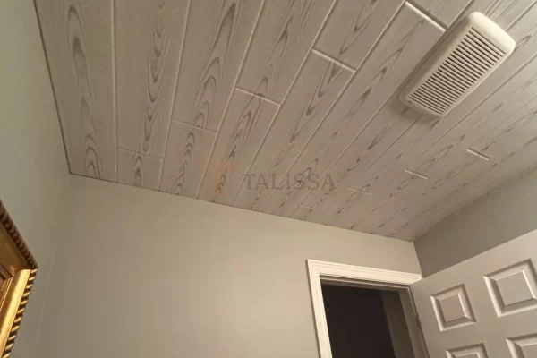 A beautifully renovated bathroom in Woodbridge, ON, featuring soft grey walls and our modern Driftwood Ash Wood Look Styrofoam Ceiling Planks.