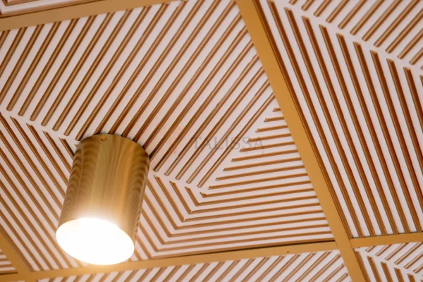Close-up of the 362 Hypnotic Triangles Faux Tin Ceiling Tiles, highlighting the crisp geometric pattern and neatly integrated light fixtures.