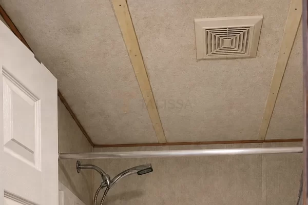 outdated trailer house bathroom ceiling before renovation