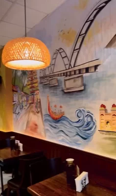 Plain restaurant ceiling before the installation of decorative faux wood beams.
