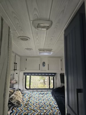 completed camper makeover whitewash wood ceiling