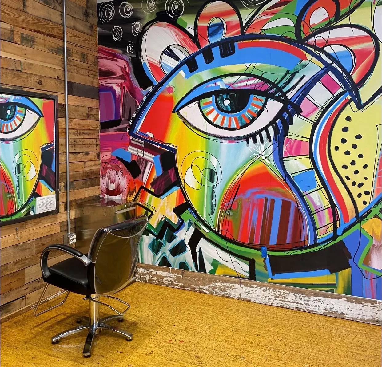 MU1592 Picasso abstract wall mural behind a styling chair in a South River, NJ hair salon