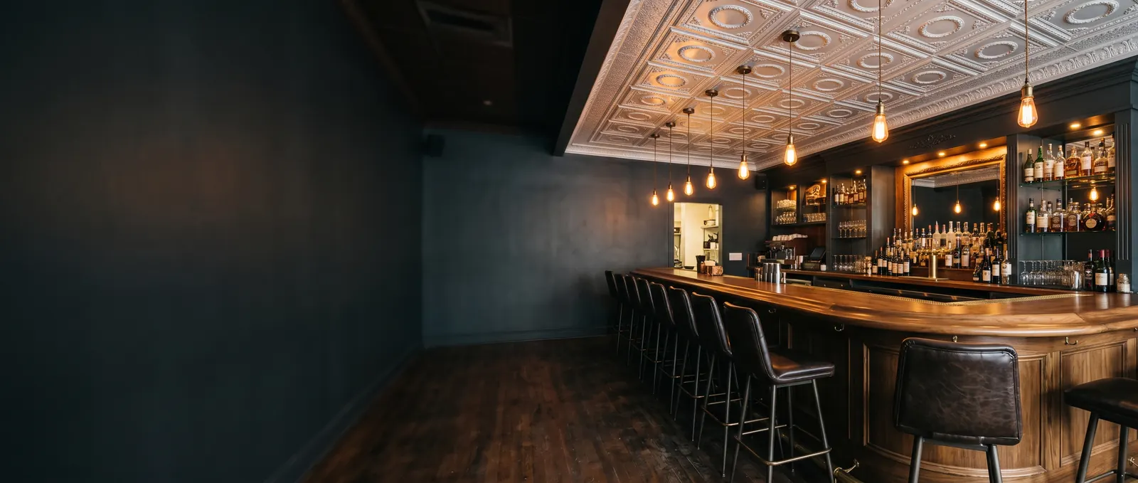 Bar with a white embossed ceiling tile ceiling